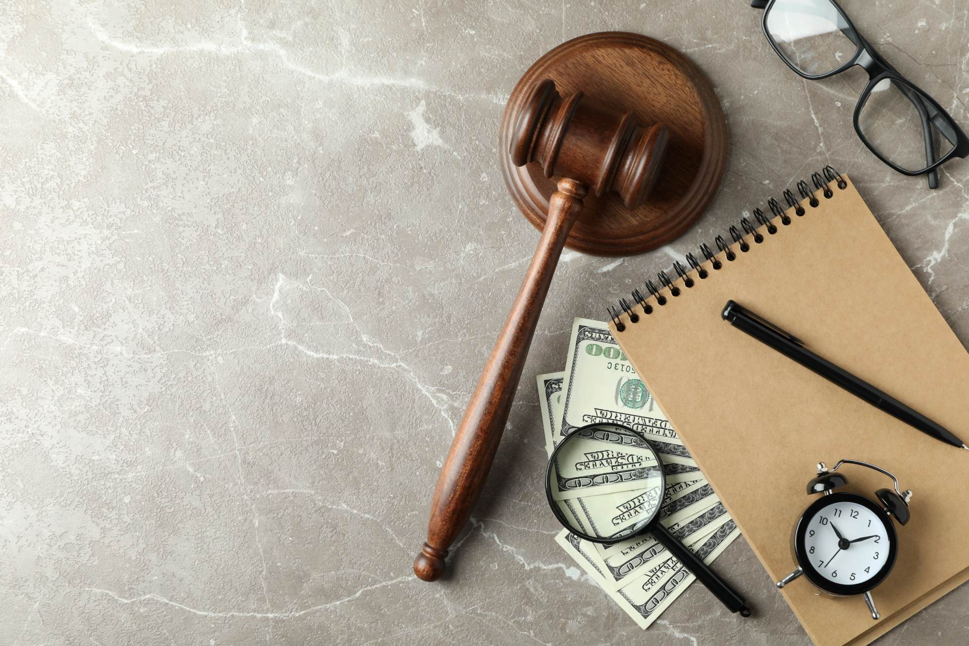 lawyer's gavel, clock, agenda and money to track billable hours